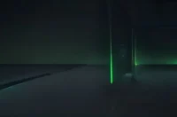 A dark‑mode developer scene with a glowing terminal showing Kubernetes StatefulSet and Deployment YAML, highlighted in neon green, illustrating the “Kubernetes StatefulSet vs Deployment” comparison.
