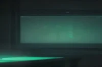 A dark‑mode developer scene with a glowing terminal and sleek hardware highlighted by green neon accents, illustrating AI Micro‑Frontends performance tips.