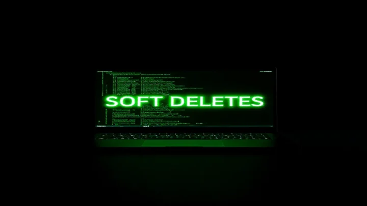 A dark‑mode developer scene illustrating soft deletes with Prisma in a Node.js environment, featuring a glowing terminal and neon green accents.