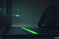A futuristic dark-mode blog cover featuring glowing green neon accents and the text "AI AGENT MONOREPO" centered over a sleek laptop keyboard.