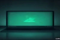 Dark‑mode developer workspace with a glowing terminal displaying Go code and neon green accents, illustrating how to prevent goroutine leaks.
