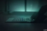 A dark-themed blog cover featuring glowing green terminal code and the text "REFLEX AGENT" to illustrate an article about a simple reflex agent in AI.